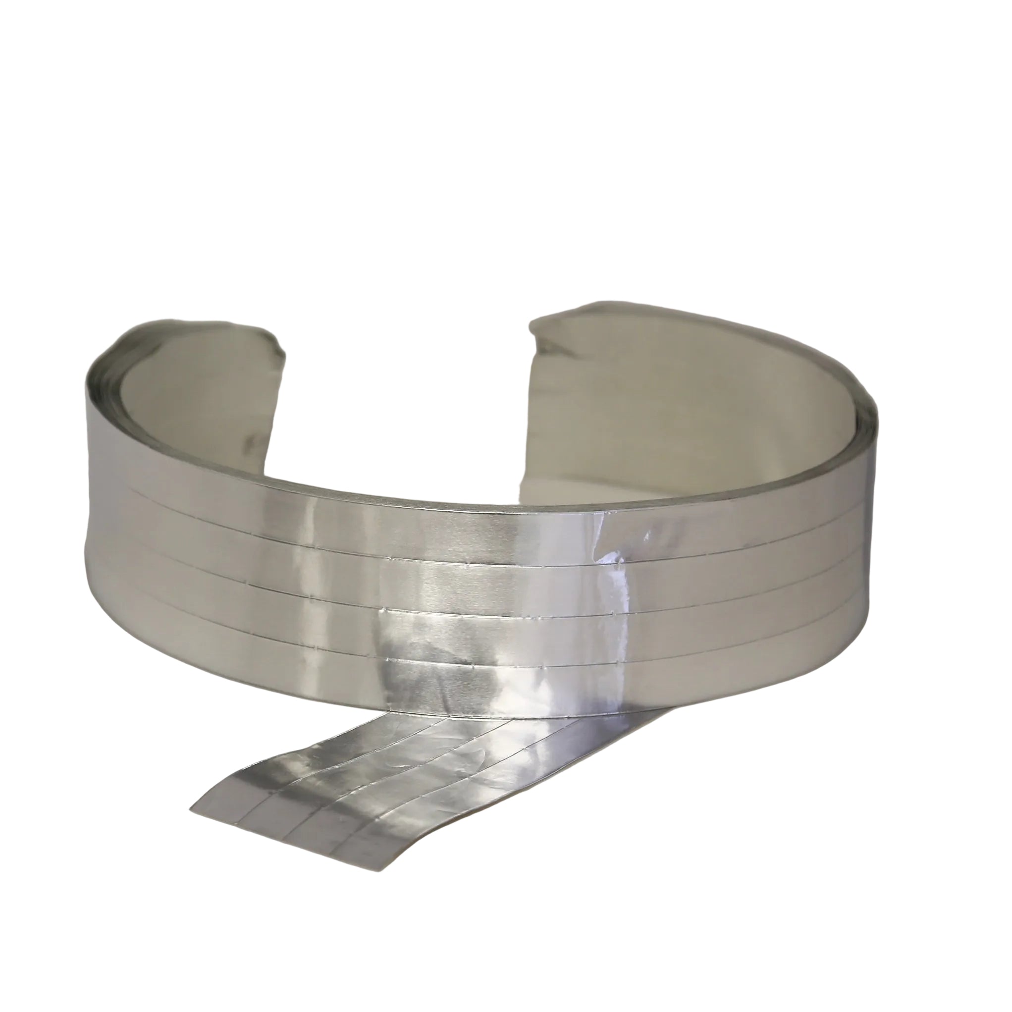 Metallic foil tape roll on a white background