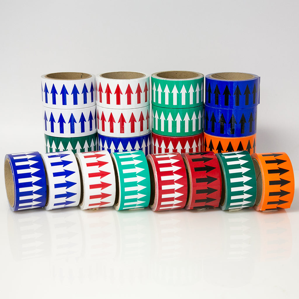 Assorted rolls of tape with arrow patterns on a white background