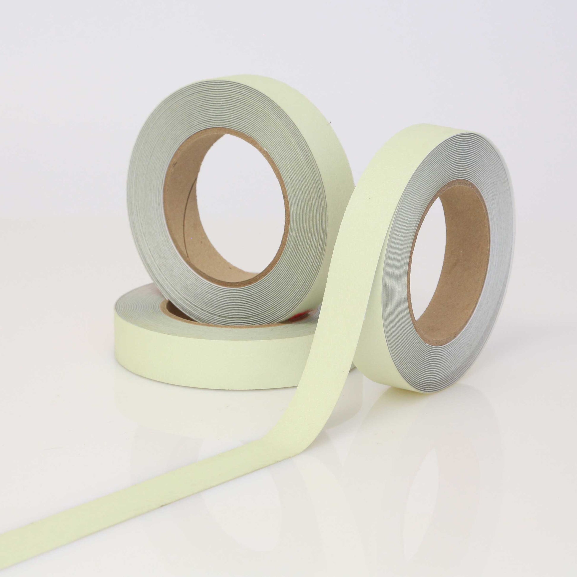Two rolls of light green tape on a white background