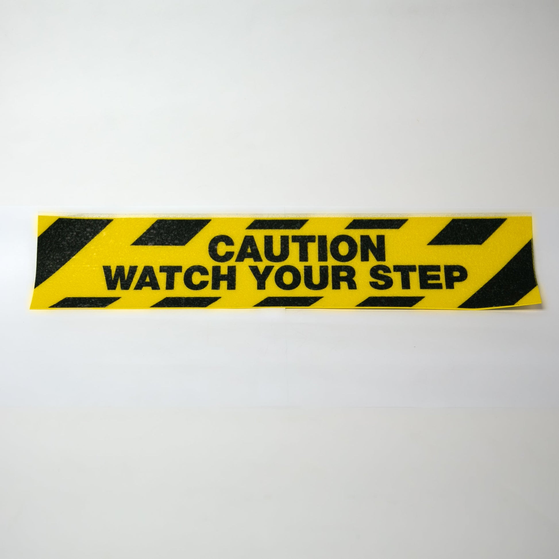 ANTI - SLIP VINYL LABELS - Caution Watch Your Step - NADCO Tapes & Labels, Inc.