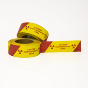 Caution Contaminated Area with Rad Symbol & Stripe and 7" perforation 2" X 36 yards - NADCO Tapes & Labels, Inc.