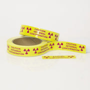 Caution Internal Contamination with Rad Symbols 1" x 3.5" Pieces on 36 yard roll - NADCO Tapes & Labels, Inc.