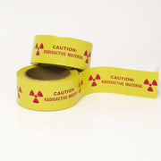 Caution Radioactive Material 2" x 6" Pieces on 36 yard Roll - NADCO Tapes & Labels, Inc.